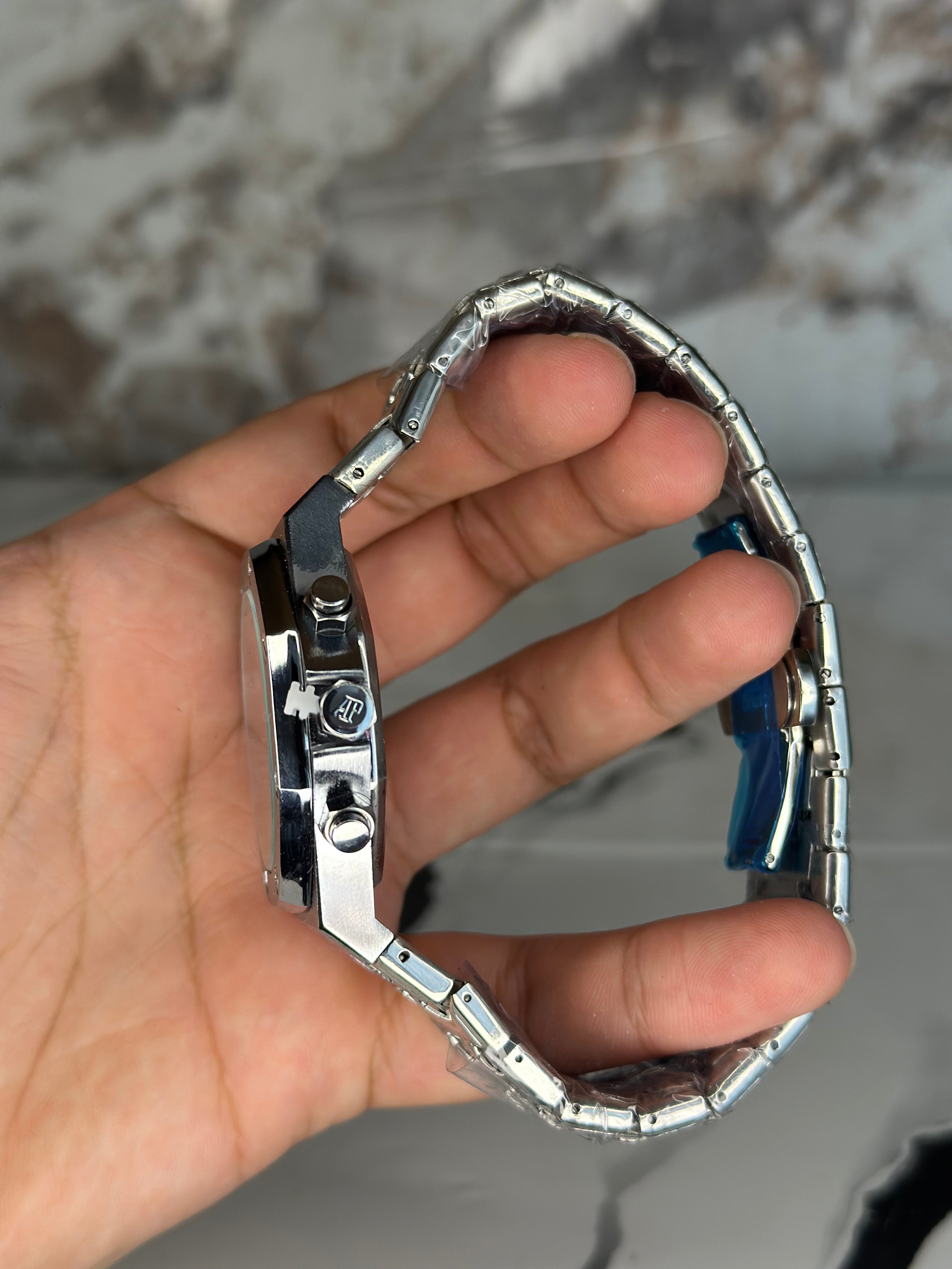 Audemars Piguet AP fondo azul  pulsera metálica cronógrafo