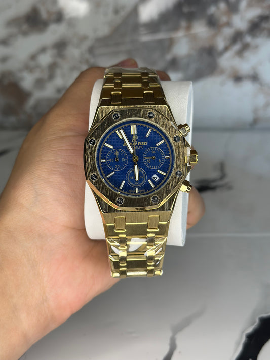Audemars Piguet AP fondo azul bisel dorado pulsera metálica cronógrafo