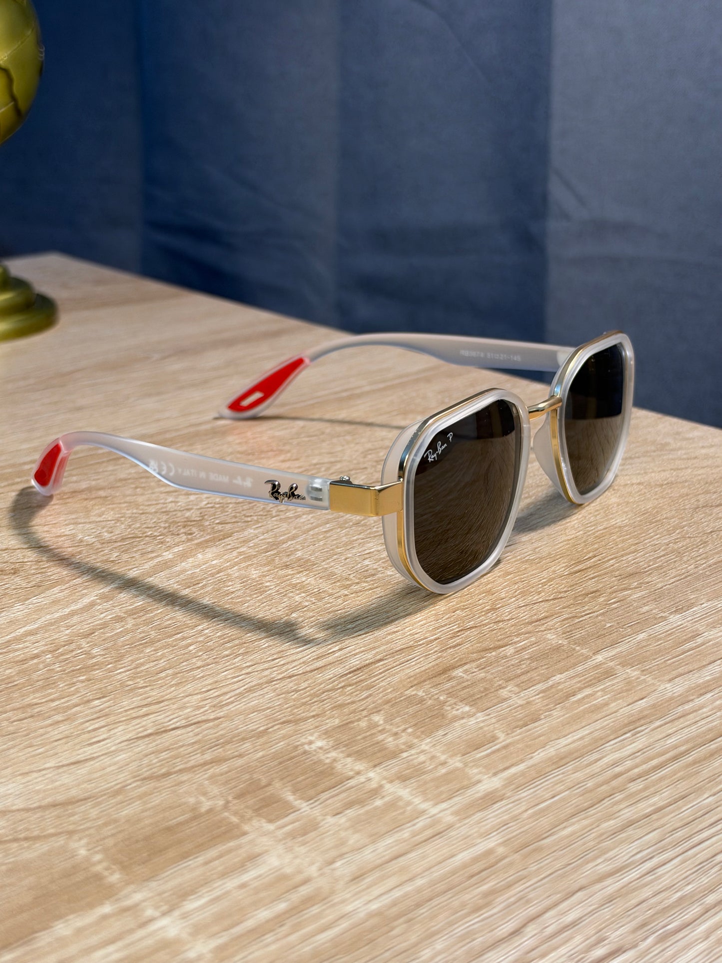 RAY-BAN X FERRARI TRANSPARENTE CON DORADO