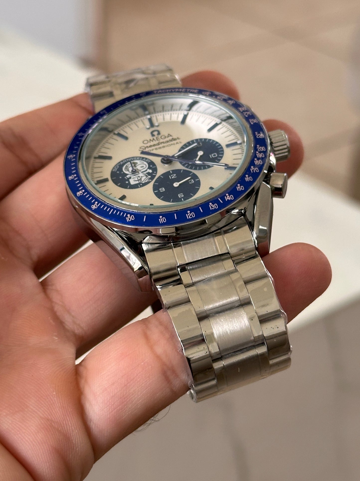 OMEGA EDICION SPECIAL SNOOPY FONDO BLANCO BISEL AZUL