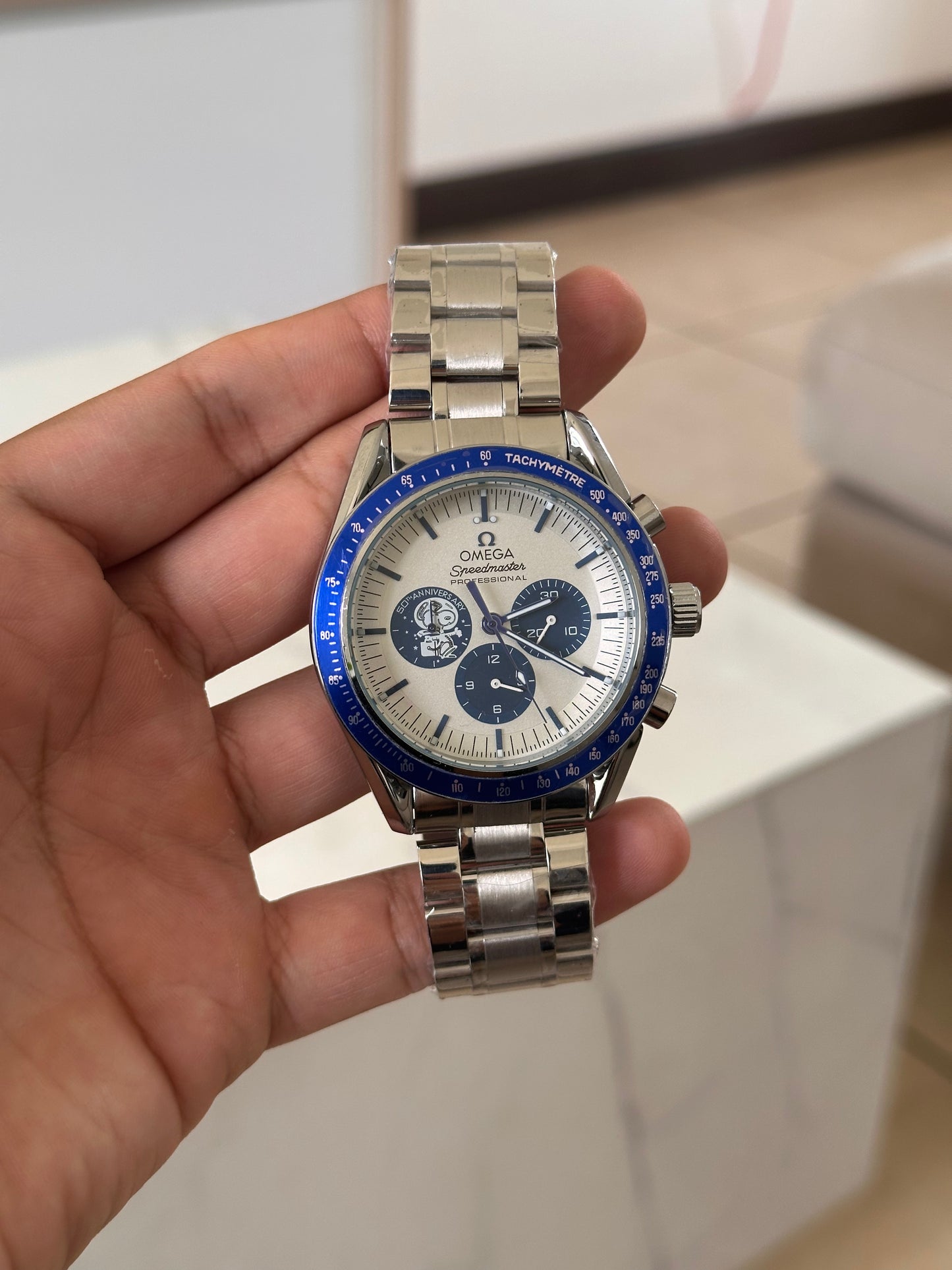 OMEGA EDICION SPECIAL SNOOPY FONDO BLANCO BISEL AZUL