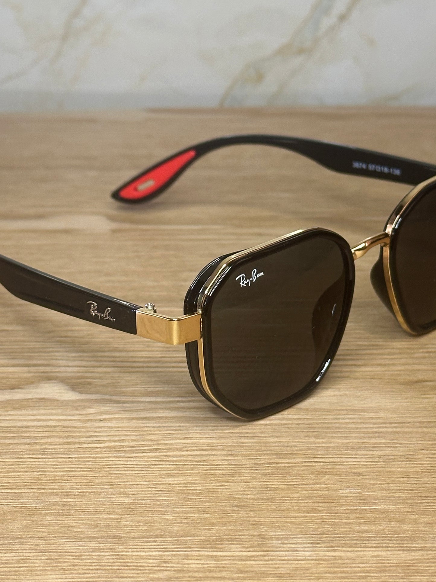 Gafas de sol ray-ban scuderia ferrari doradas con negro polarizadas