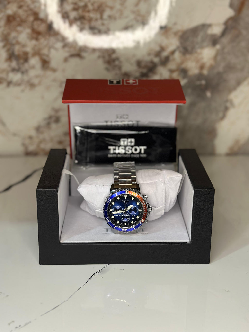 Reloj Tissot seastar 40mm correa metalica azul con naranja