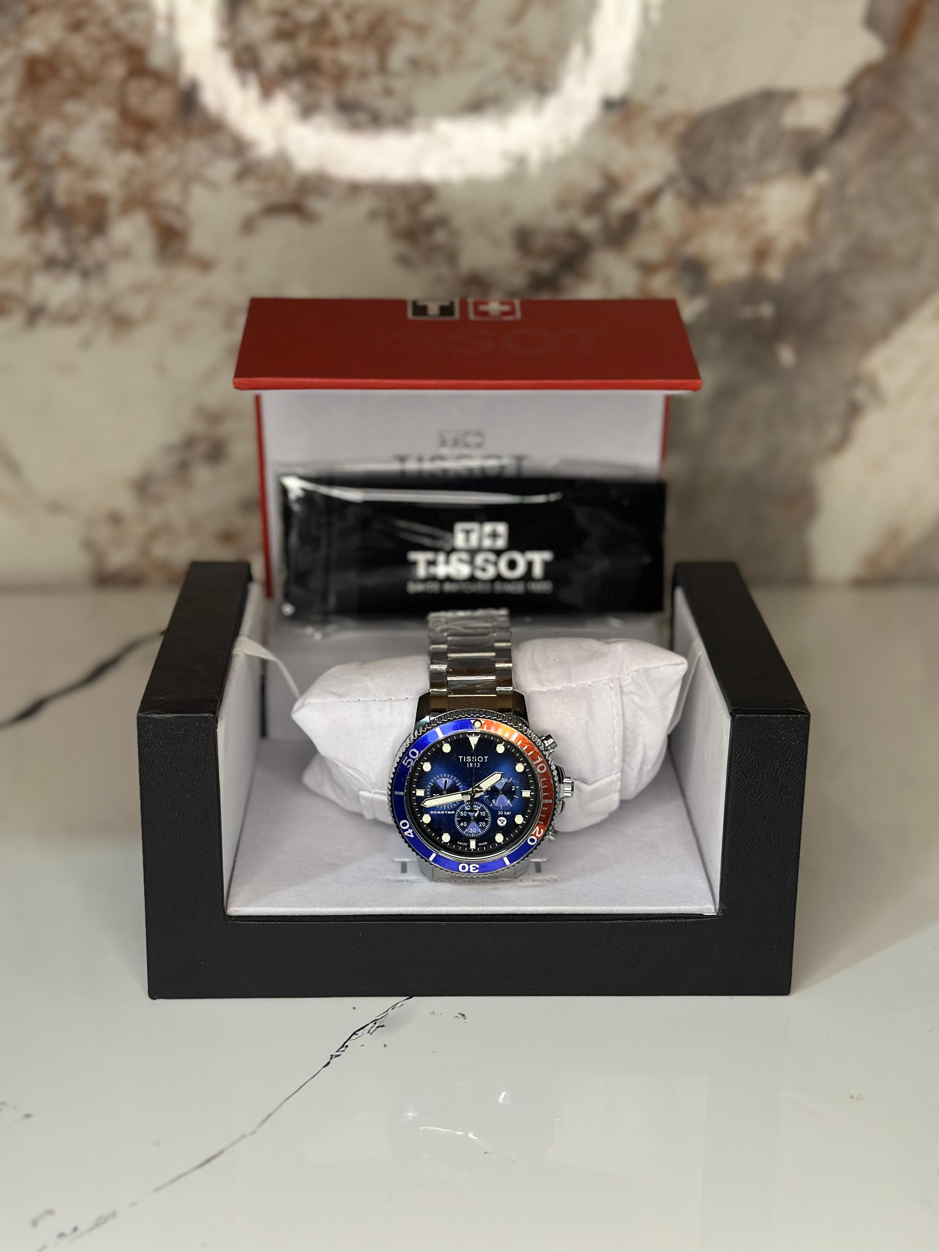 Reloj Tissot seastar 40mm correa metalica azul con naranja