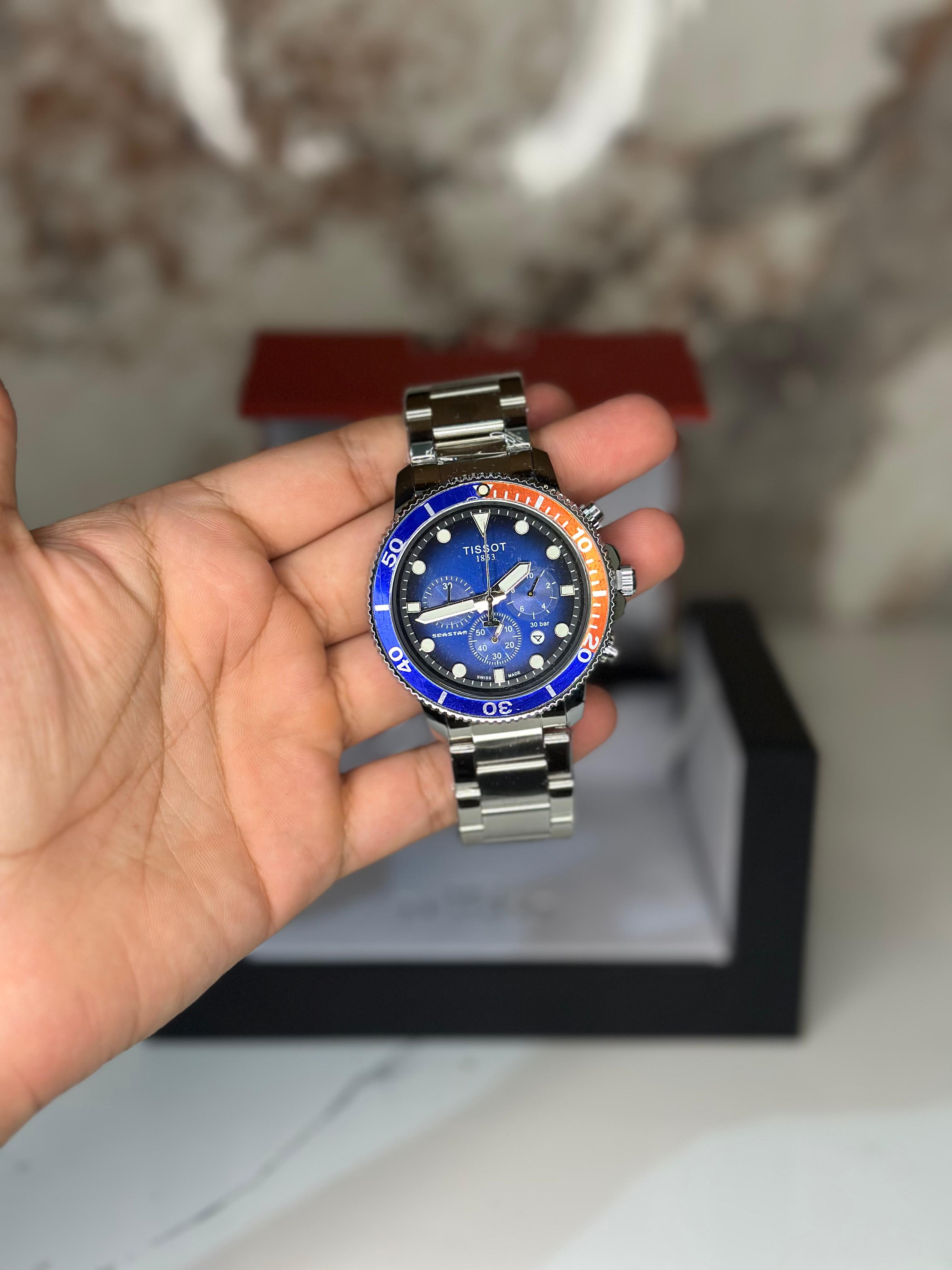 Reloj Tissot seastar 40mm correa metalica azul con naranja