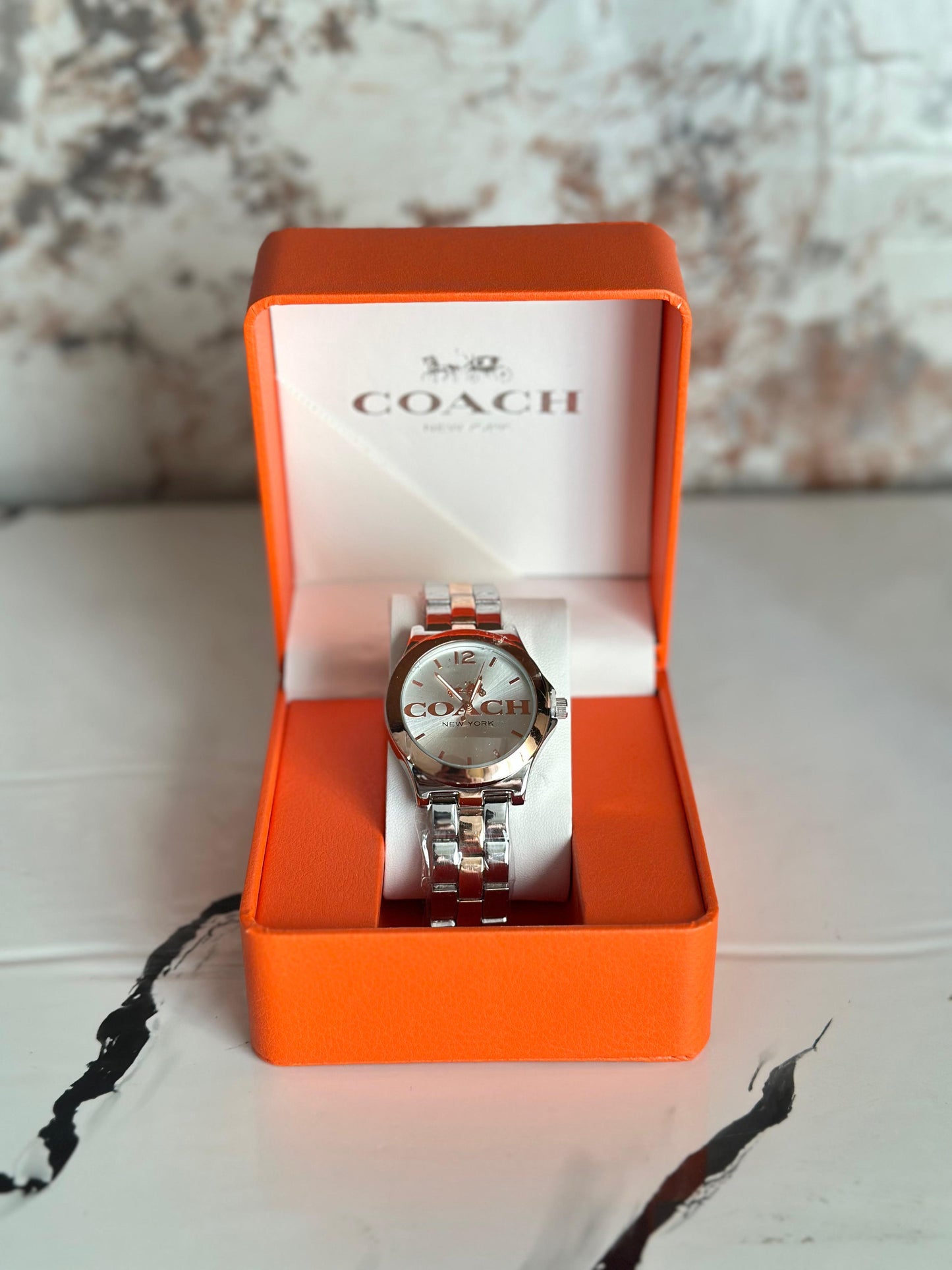 Reloj coach para dama plateado con rose gold