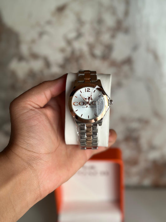 Reloj coach para dama plateado con rose gold
