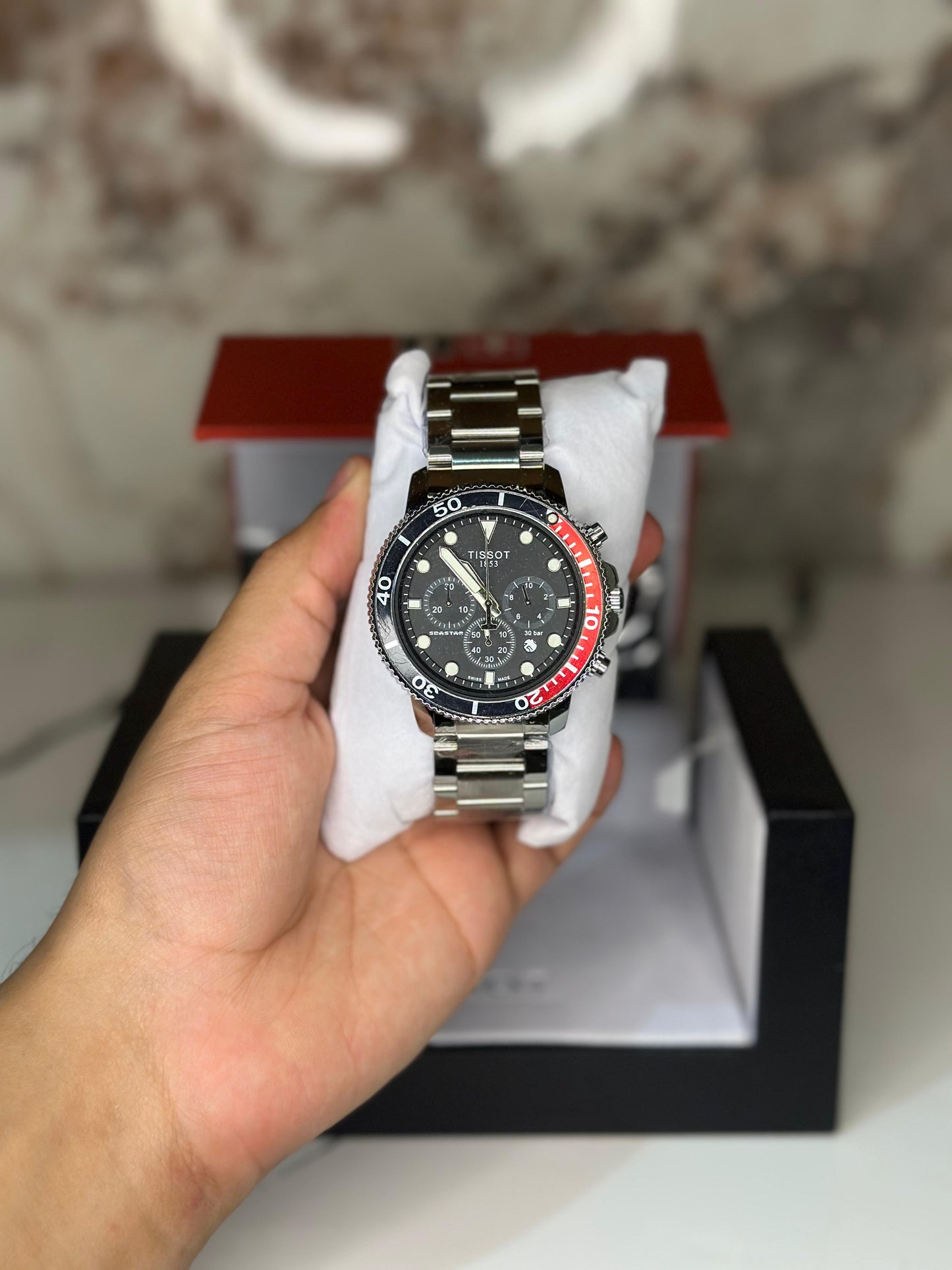 Reloj Tissot seastar 40mm correa metalica rojo con oscuro