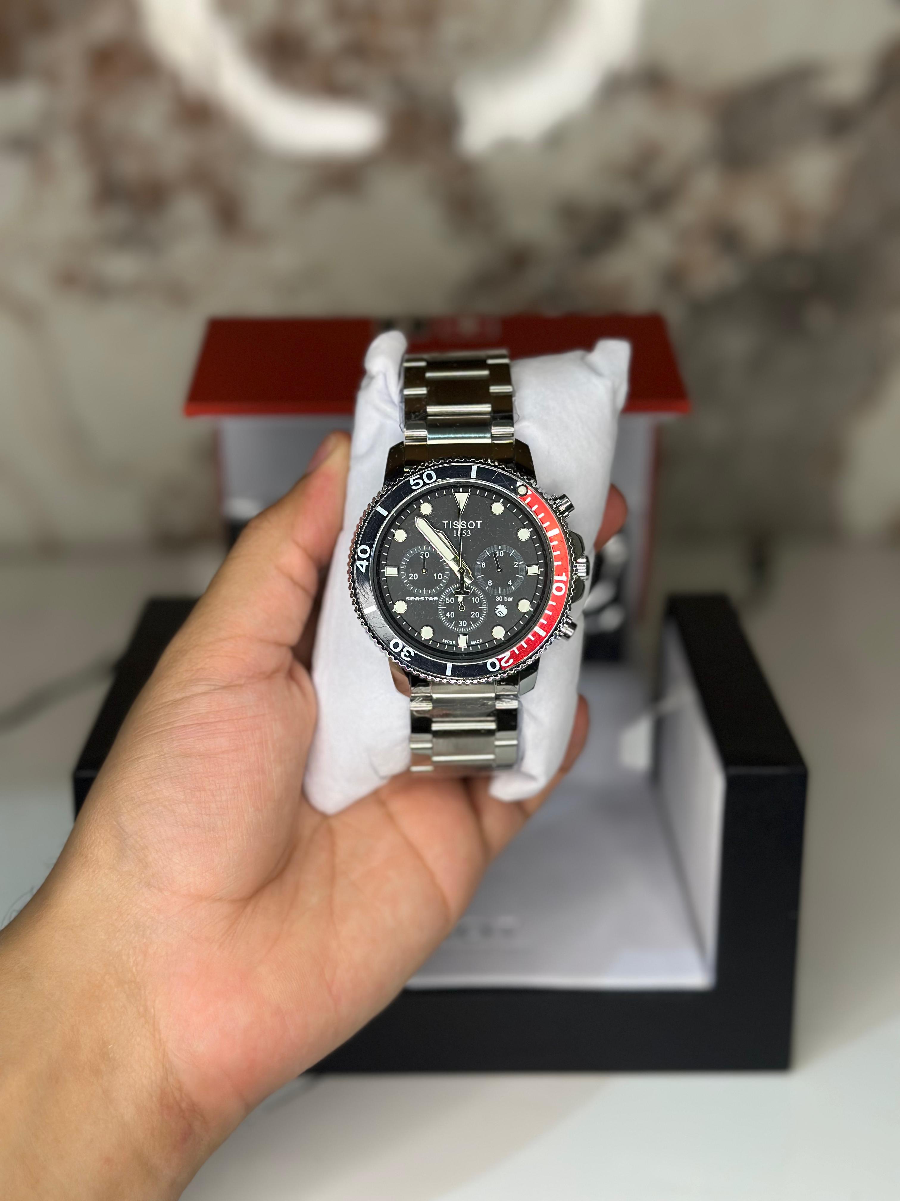 Reloj Tissot seastar 40mm correa metalica rojo con oscuro